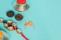 Raksha bandhan raakhi or rakhi with Kumkum,areca and rice on blue background