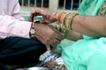 Indian young sister tying rakhi on brother`s wrist Royalty Free Stock Photo