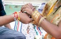 Indian young sister tying rakhi on brother`s wrist Royalty Free Stock Photo