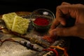 Rakshabandhan special sister holding rice to do tilak with a plate decorated with rakhi sweets