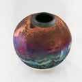 RAAQUU raku fired pottery globe vase Royalty Free Stock Photo