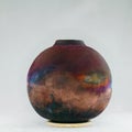 RAAQUU raku fired pottery globe vase Royalty Free Stock Photo