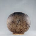 RAAQUU raku fired pottery globe vase Royalty Free Stock Photo