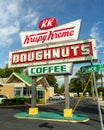 Raleigh, NC / United States - Oct. 12, 2019: Vertical three-quarter image of the iconic neon Krispy Kreme Sign during the day