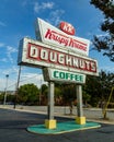 Raleigh, NC / United States - Oct. 12, 2019: Vertical three-quarter image of the iconic neon Krispy Kreme Sign during the day