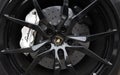 RALEIGH,NC/USA - 09-04-2019: Closeup of a Lamborghini sports car wheel and tire, with the bull logo in the center