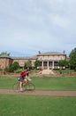 RALEIGH,NC/USA - 4-25-2019: A student rides a bike across the campus of North Carolina State University in Raleigh