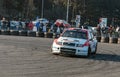Rally car racing with crowd watching in the back Royalty Free Stock Photo