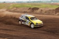 Rally off-road car make a turn with the clouds and splashes of sand, gravel and dust during rally championship