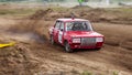 Rally off-road car make a turn with the clouds and splashes of sand, gravel and dust during rally championship