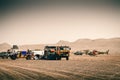 Rally raid camp in the middle of the desert with cars, trucks and support helicopters as part of the Morocco Desert Challenge 2023
