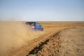 a rally sport car driving on the drit gravel race, fast speed with mud splash Royalty Free Stock Photo