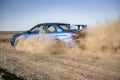 a rally sport car driving on the drit gravel race, fast speed with mud splash Royalty Free Stock Photo