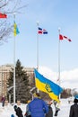 Rally with in support of Ukraine against war. Protest and march against Russian invasion. Man with Ukranian flag in