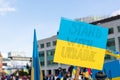 Rally in support of Ukraine against war. Protest and march against Russian invasion. Ukrainian flags. Stand with Ukrain