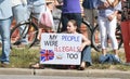 Rally to Secure Our Borders counter protestor with sign at a Rally to Secure Our Borders