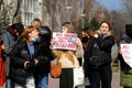 Rally for women rights in International Women Day March 8, feminism. Girl is holding poster in English - My favorite season is