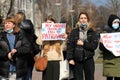 Rally for women rights in International Women Day March 8, feminism. Girl is holding poster in English - My favorite season is