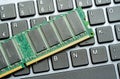 RAM stick laying on a computer keyboard, desktop PC memory upgrade parts components replacement and service simple concept, nobody