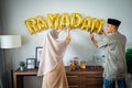 Ramadan gold balloon text on the wall