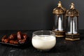 Ramadan Concept. Dates Milk Susu Kurma with Date Fruit in the Background. Ramadan Lantern on Wooden Table