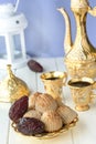 Ramadan concept. Maamoul traditional arab filled pastry or cookie with dates or nuts served with coffee golden set. Eastern sweets Royalty Free Stock Photo