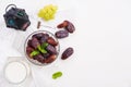 Ramadan food and drinks concept. Ramadan Lantern with Milk, dates fruit, grape and Mint leaves on a white wooden table background Royalty Free Stock Photo