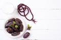 Ramadan food and drinks concept. Wood rosary, milk and dates fruit on a white wooden table background. Top view, Flat lay Royalty Free Stock Photo