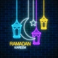 Ramadan greeting card with fanus lanterns, star and crescent. Glowing neon ramadan holy month sign Royalty Free Stock Photo