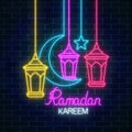 Ramadan greeting card with star, crescent and fanus lanterns. Glowing neon ramadan holy month sign Royalty Free Stock Photo