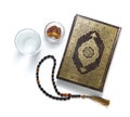 Quran Holy Book, Water, Dates and Rosary, Isolated on White