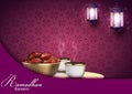 Ramadan Kareem background. Iftar party with traditional coffee cup, bowl of dates and lanterns hanging in a purple glowing backgro Royalty Free Stock Photo