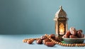 Ramadan Kareem banner design with dates fruit and beads on light blue background. Eid Mubarak, Muslim Holy Month greeting card Royalty Free Stock Photo