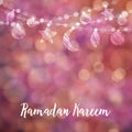 Ramadan Kareem card, invitation. Hanging moon, stars, balls. Festive colorful glitter blurred web background, bokeh lights.