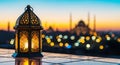 Ramadan kareem copyspace a lantern on a rooftop with a mosque in the background at sunset Royalty Free Stock Photo
