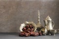Ramadan kareem with dried dates and authentic metal zamzam water carafe