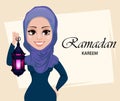 Ramadan Kareem greeting card with beautiful Muslim woman holding traditional Arabic lantern. Royalty Free Stock Photo