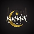 Ramadan Kareem greeting card - Brush calligraphy greeting against a glitter gold moon, star and silhouette of mosque. Royalty Free Stock Photo