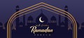 Ramadan Kareem greeting card. Design with Ramadan greeting text and golden arch on a background with mosque silhouette. Royalty Free Stock Photo