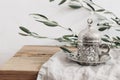 Ramadan Kareem greeting card, invitation. Closeup of ornamental decorative silver cup and saucer with tea or coffee Royalty Free Stock Photo