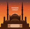 Ramadan Kareem mahya lights over a mosque silhouette