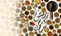 Ramadan Kareem written in Arabic language surrounded by group of dishes of spices