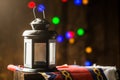 Ramadan lantern with bokeh dotes and ramadan themed cloth shot on dark wood