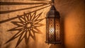 Ramadan kareem a beautifully lit lantern with copyspace on a textured wall with starlight shadows Royalty Free Stock Photo
