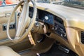 Oldsmobile Cutlass Supreme car interior - steering wheel with logo and dashboard