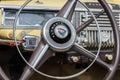 Vintage Plymouth Coupe 1940s interior - steering wheel with logo and dashboard