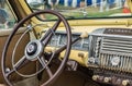 Vintage Plymouth Coupe 1940s interior - steering wheel with logo and dashboard