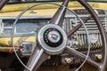 Vintage Plymouth Coupe 1940s interior - steering wheel with logo and dashboard