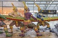 Ramayana traditional Angel captured Thai serpent or Naga sculpture statue in departure area of Suvarnabhumi International Airport