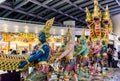 Sculpture of Ramayana traditional Angel captured Thai serpent or Naga in Suvarnabhumi International Airport Bangkok, Thailand